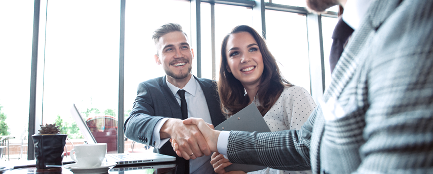 Image of business partners shaking hands.