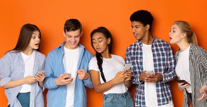 image of teens looking at each other's phones