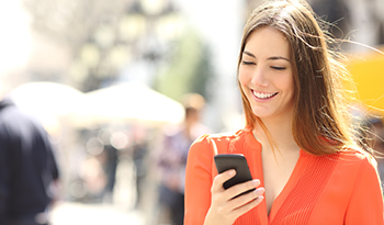 Image of a young lady using a cell phone