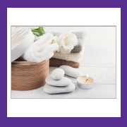 purple box with spa stones, towel and basket